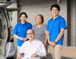 elderly and caretaker standing