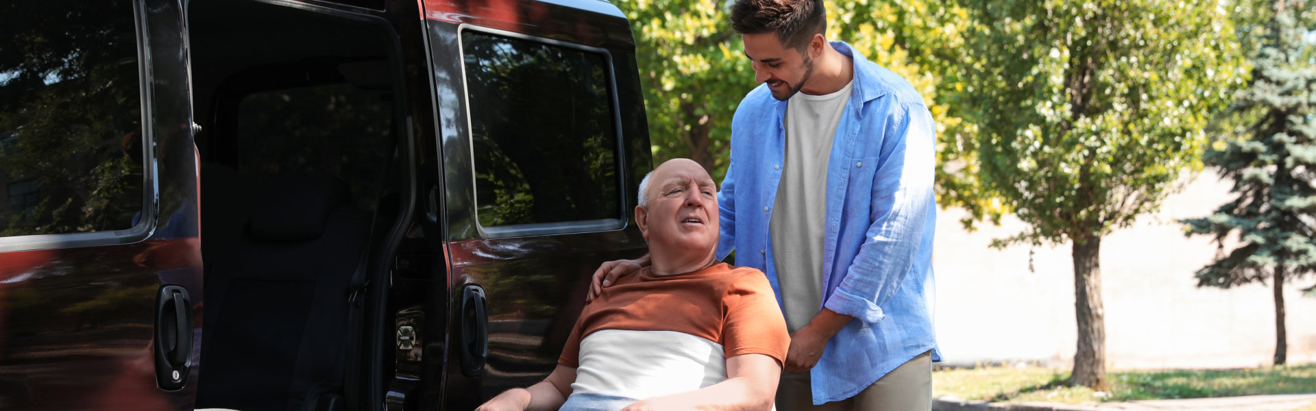 man assisting elderly